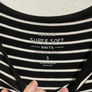 Black and white, striped, long sleeve shirt.